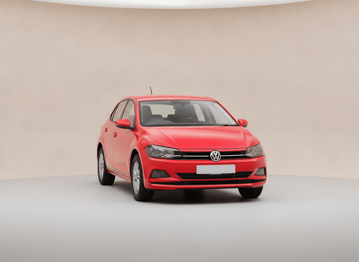 Red Volkswagen Polo hatchback in a pale studio